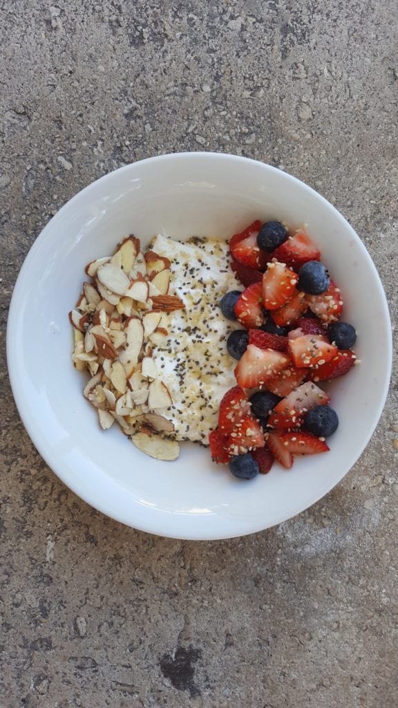 yogurt with chia seeds, sliced almonds, and berries