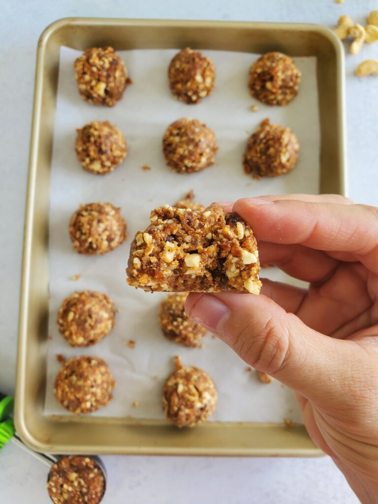 almond butter energy bites with a bite taken out