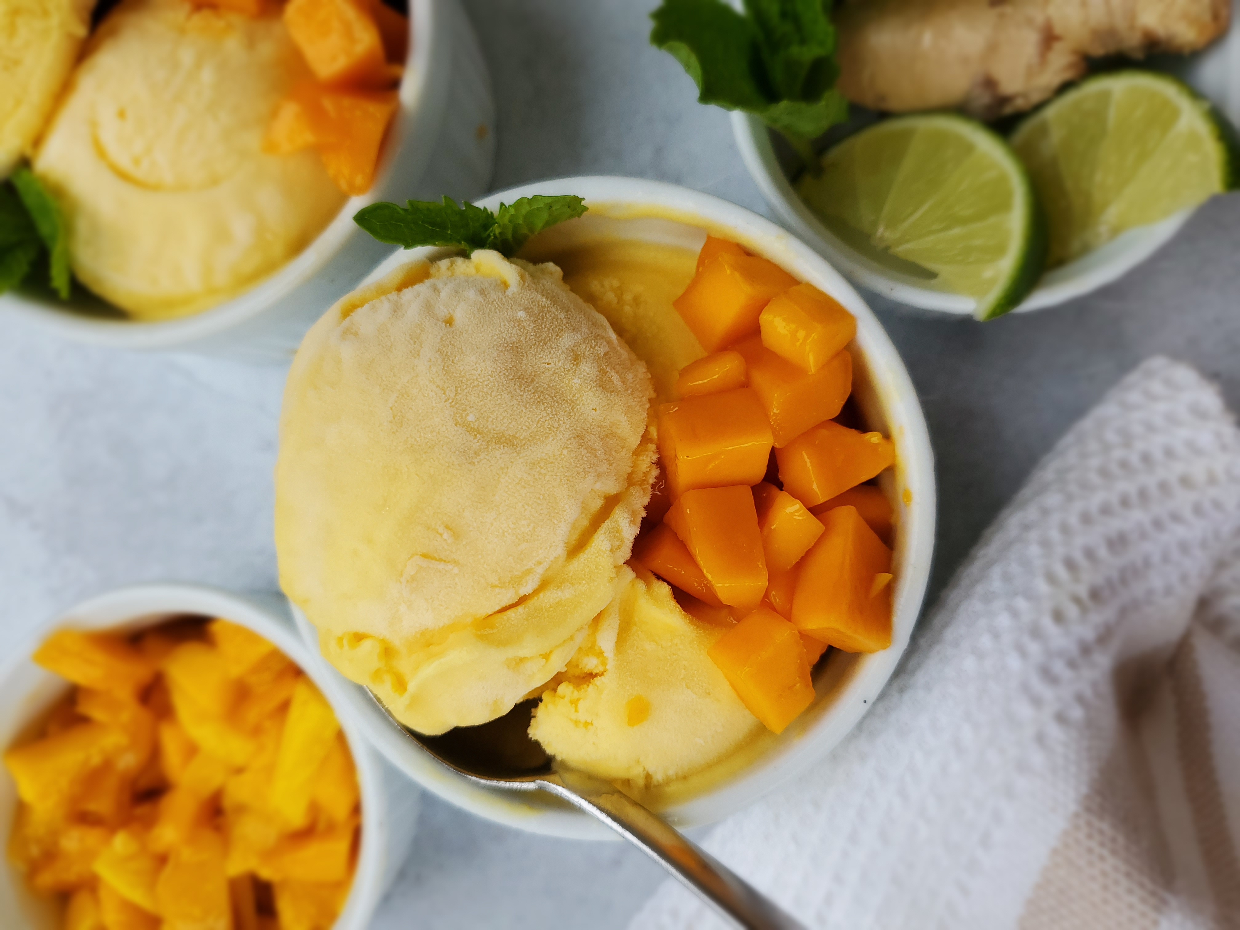 Mango Gelato in a bowl with pieces of mango on top