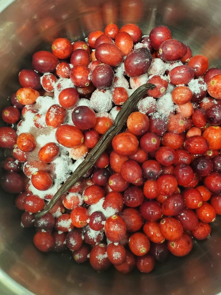 cranberries with sugar and a vanilla bean