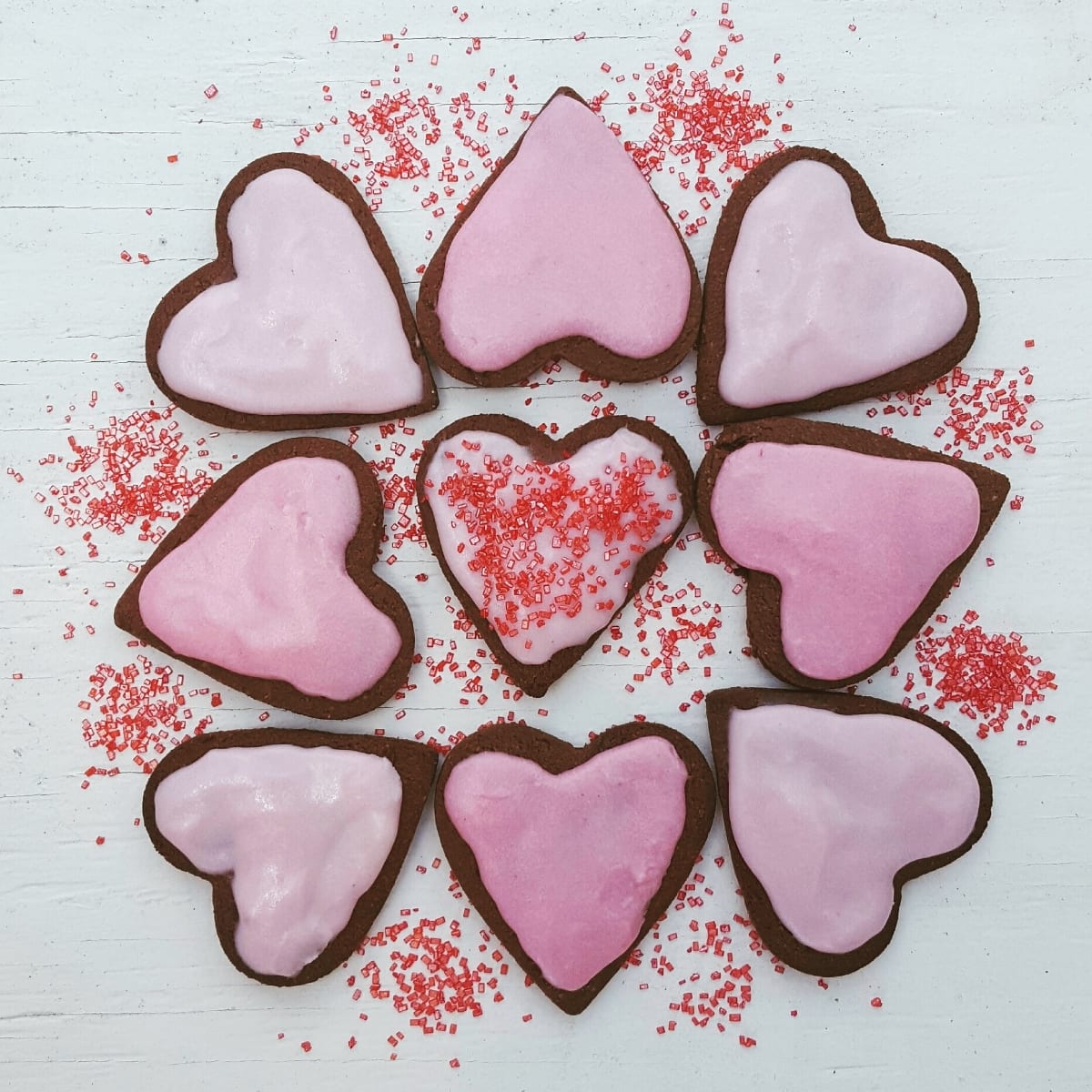 heart cookies with pink cream cheese frosting