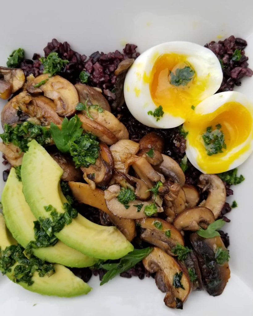 Black rice with marinated mushrooms, avocado, jammy egg, and chimichurri