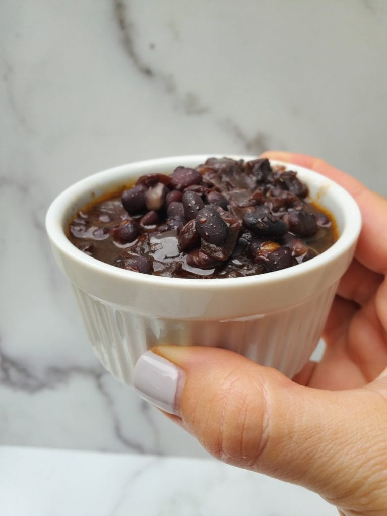cooked black beans in a ramekin