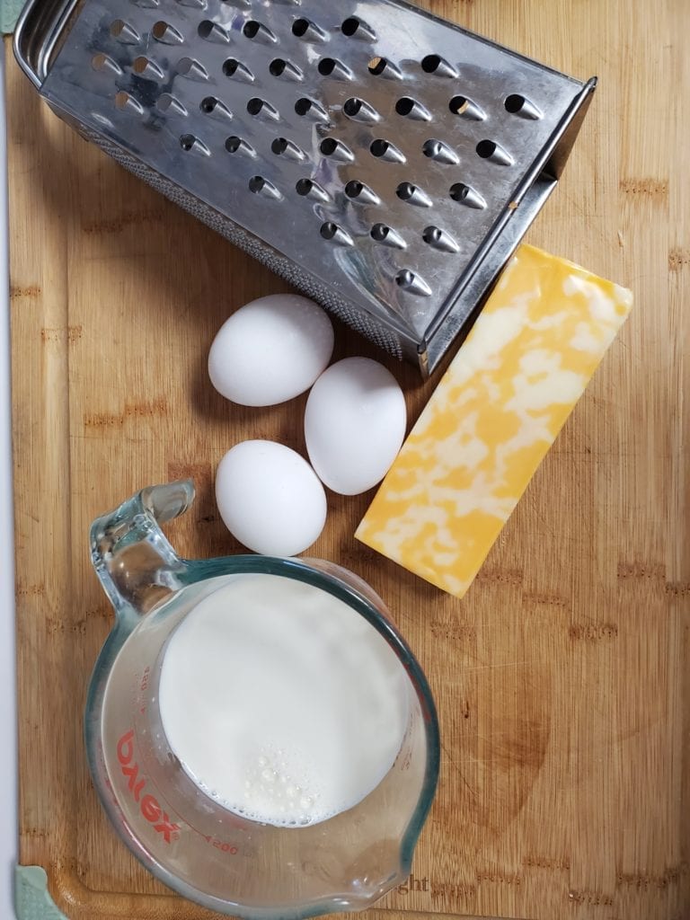milk, eggs, cheese, box grater