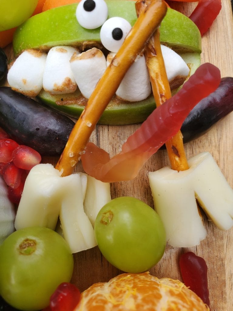 string cheese split with a pretzel sticking in it to look like a broom