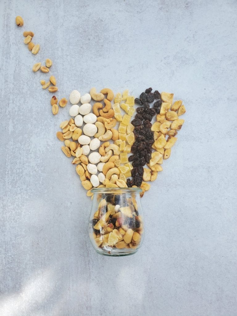 jar of nuts, seeds, dried fruit to make a trail mix