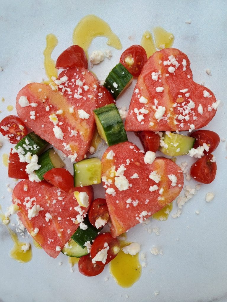 watermelon cut as a heart shape, cucumber, and feta salad