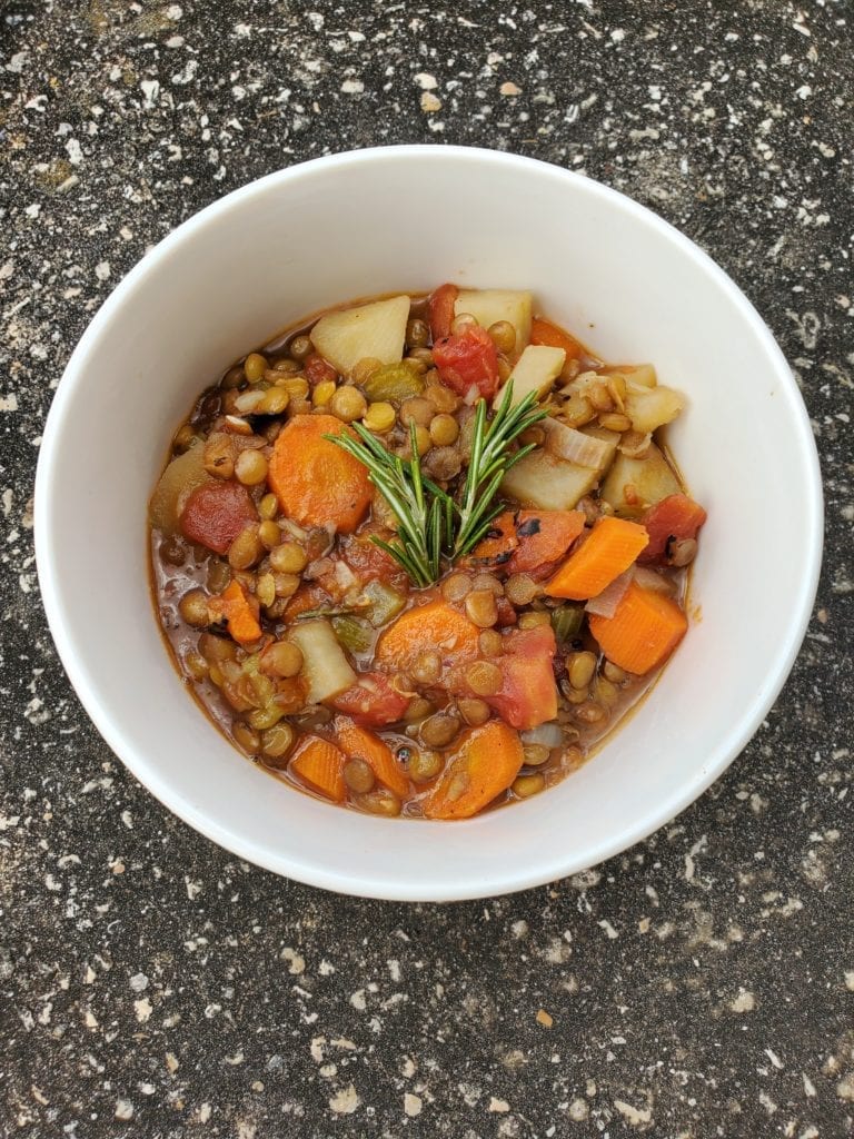 Lentil soup with a ton of veggies in a bowl