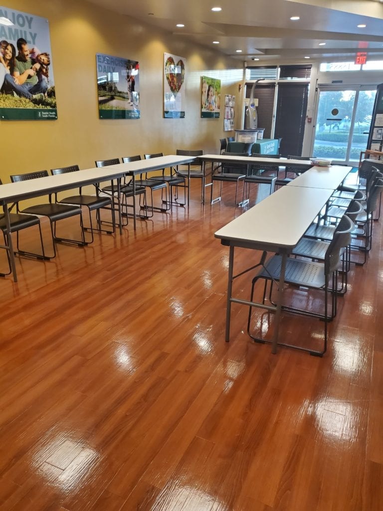 empty room with tables and chairs
