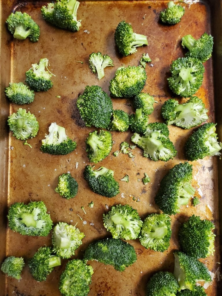 Sheet pan of broccoli before roasting