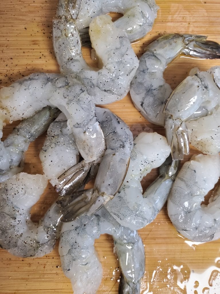 Raw shrimp on a cutting board