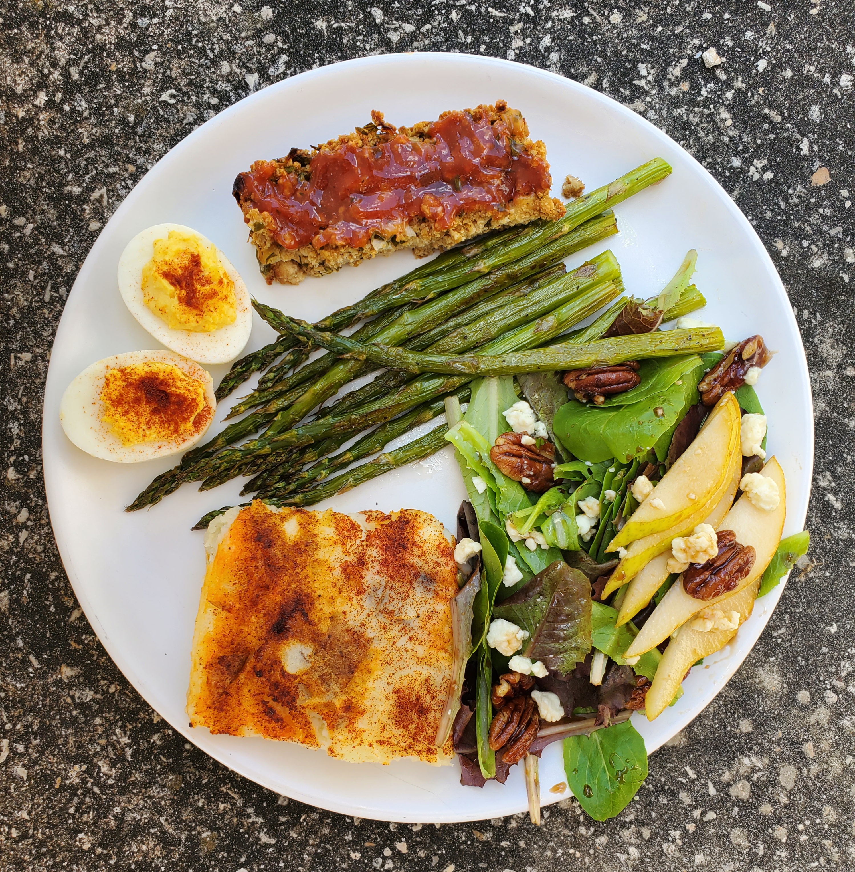 Easter dinner plate - tofu loaf, twice baked potatoes, hard-boiled eggs, asparagus, salad