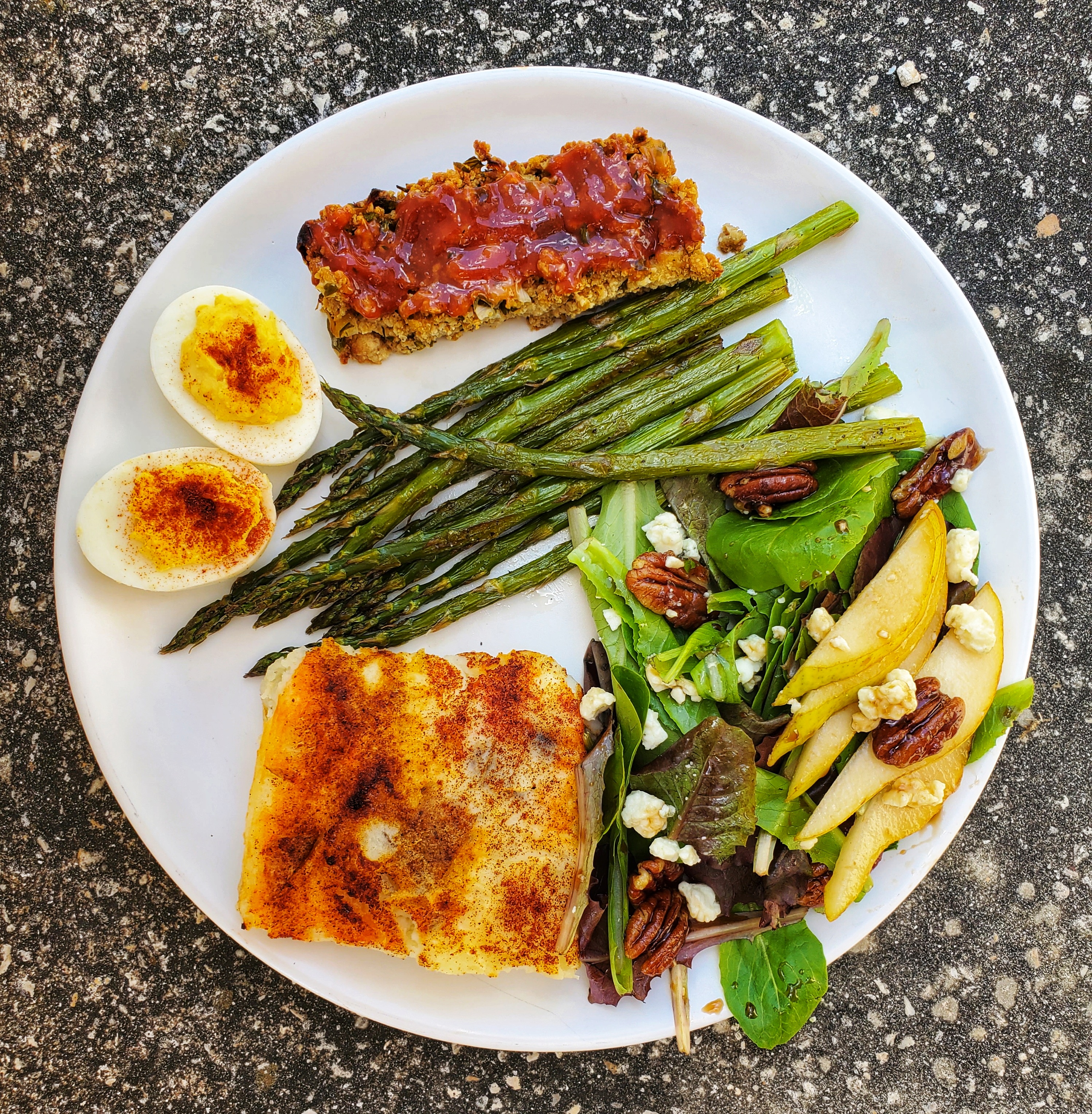 Easter dinner plate - tofu loaf, twice baked potatoes, hard-boiled eggs, asparagus, salad