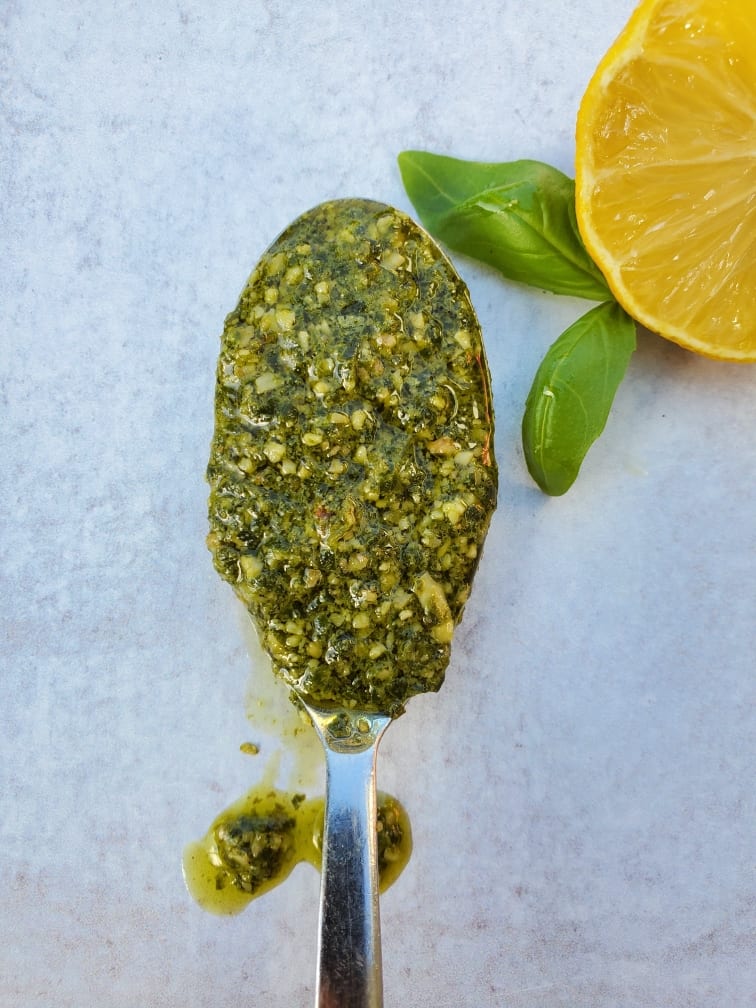 basil pesto in a spoon