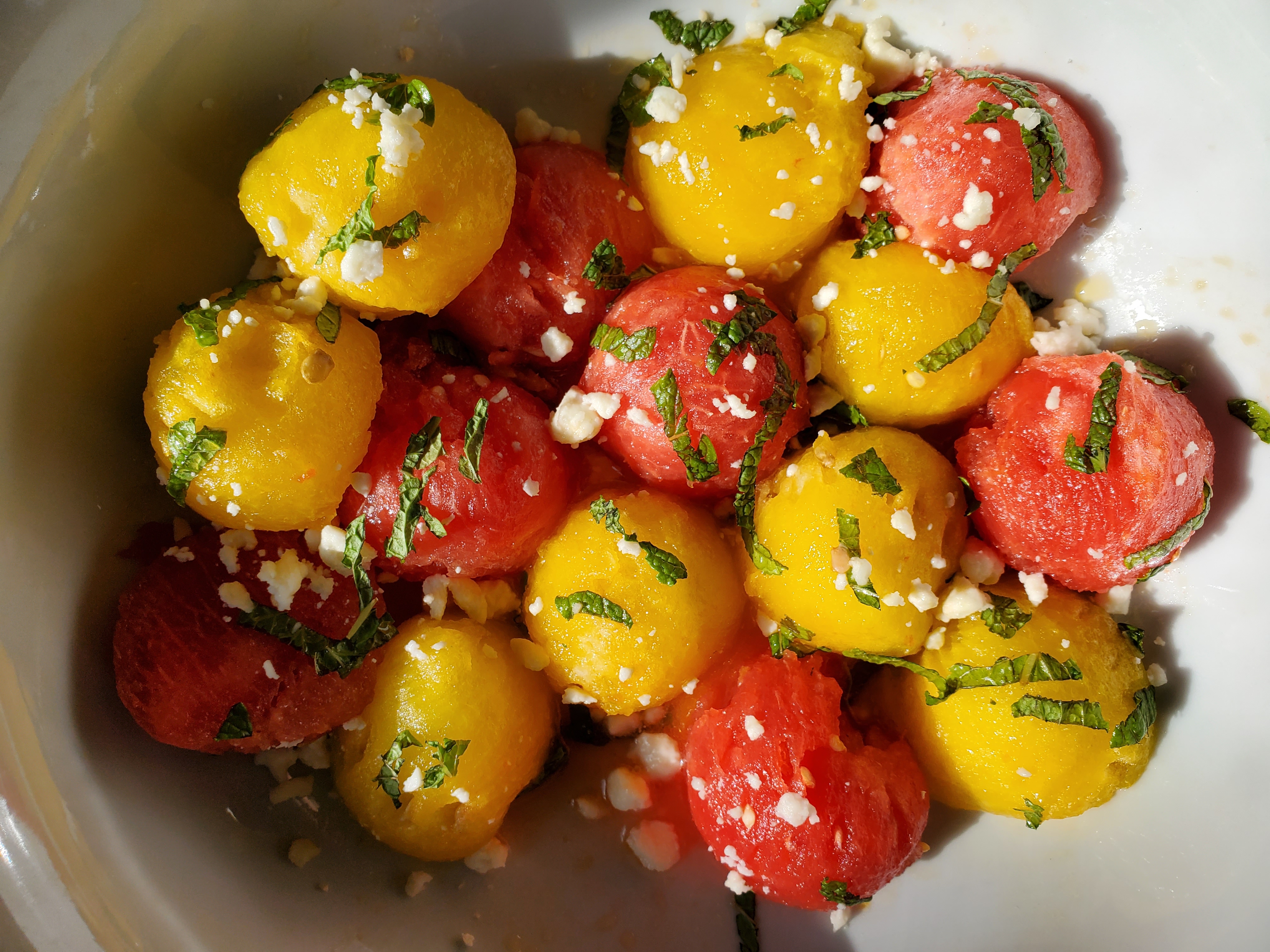 Yellow watermelon, red watermelon, mint, feta salad