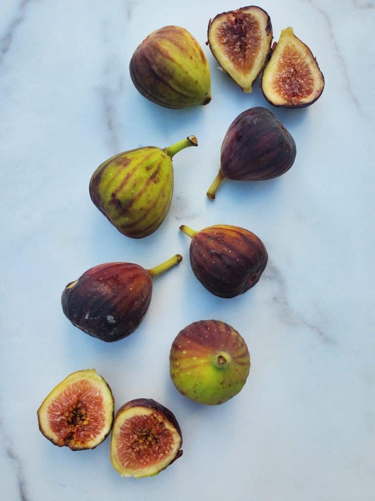 Display of black figs with a few cut open