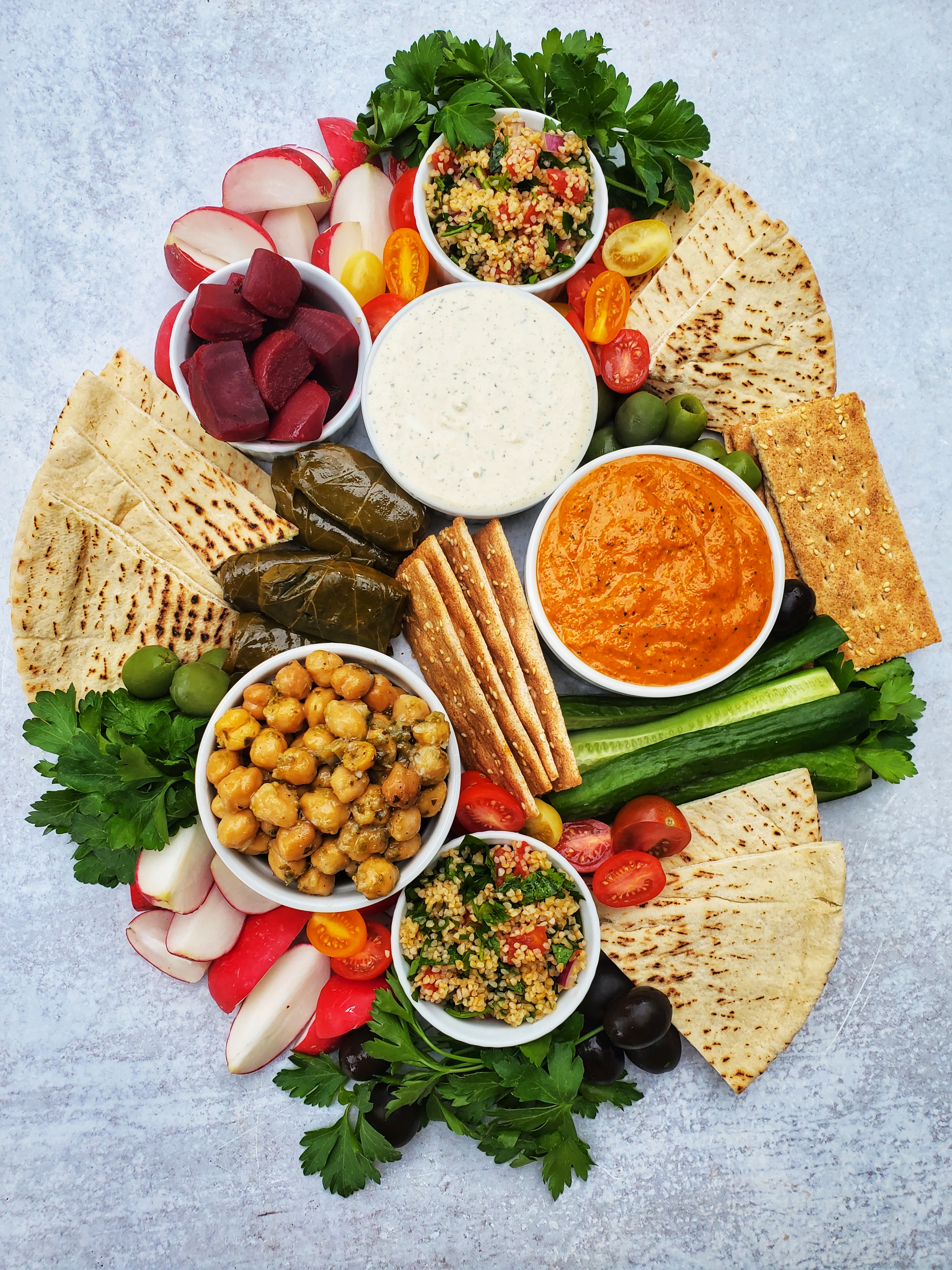 Mezze Board - Top Shot -Tabouli, Radish, Beets, labneh, pita, marinated chickpeas, romesco, cucumbers, crackers, tomatos