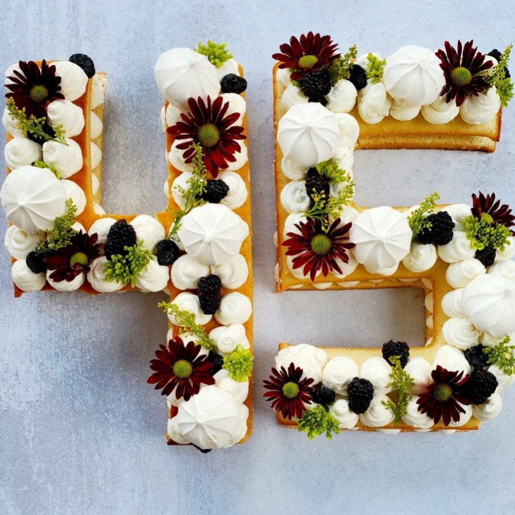 Cake in the shape of the number 45 - icing and flowers for decoration