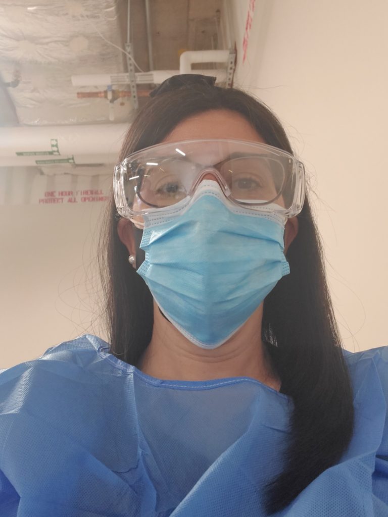 Picture of myself wearing N-95 protective gear at a vaccine site