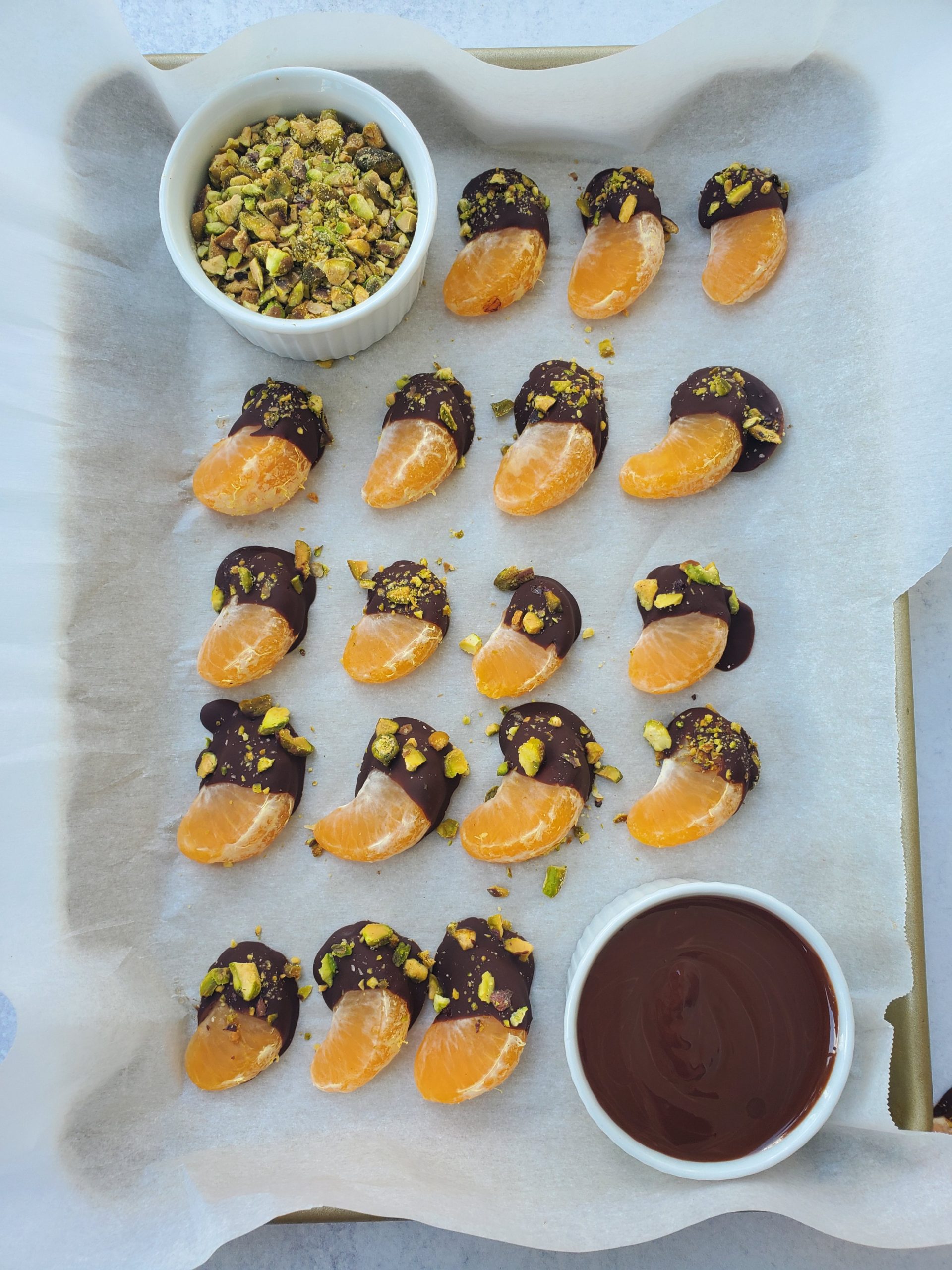 Dark Chocolate Dipped Mandarins on a Sheet Tray