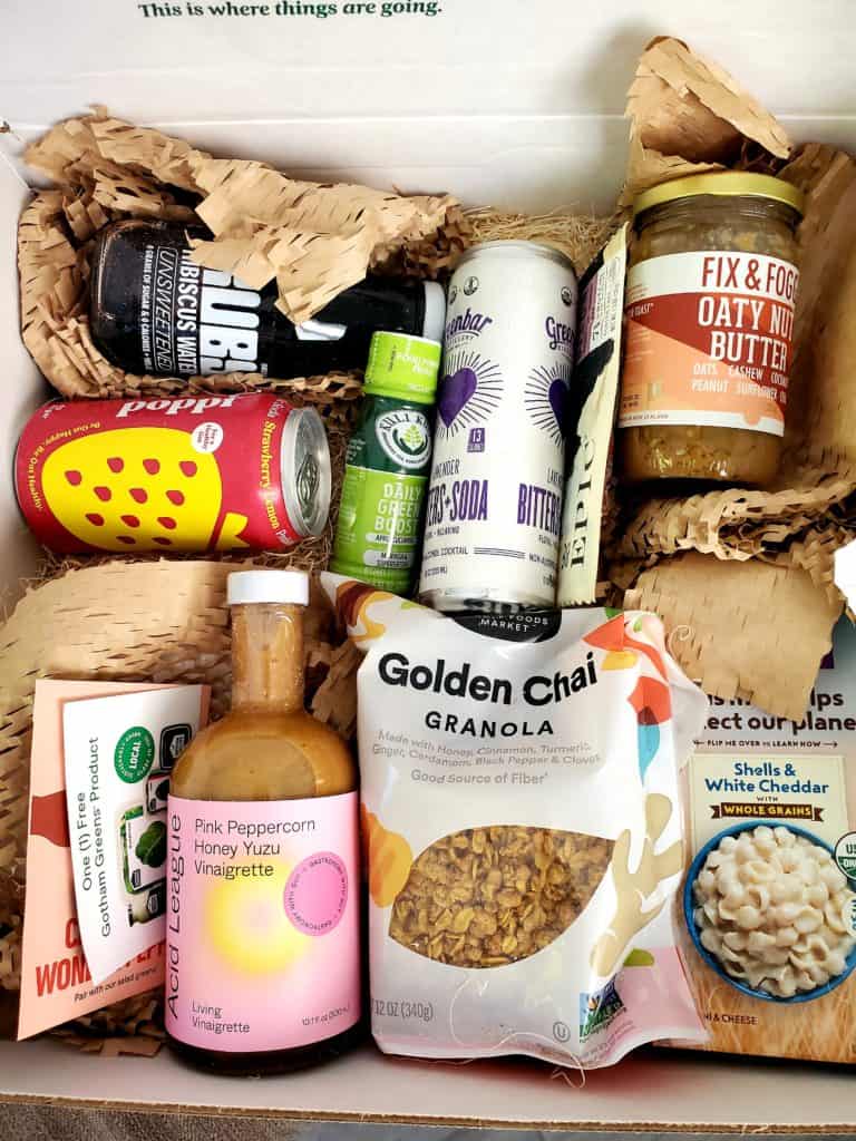 Box full of nutrition trends - hibiscus water, probiotic drink, turmeric granola, yuzu vinaigrette