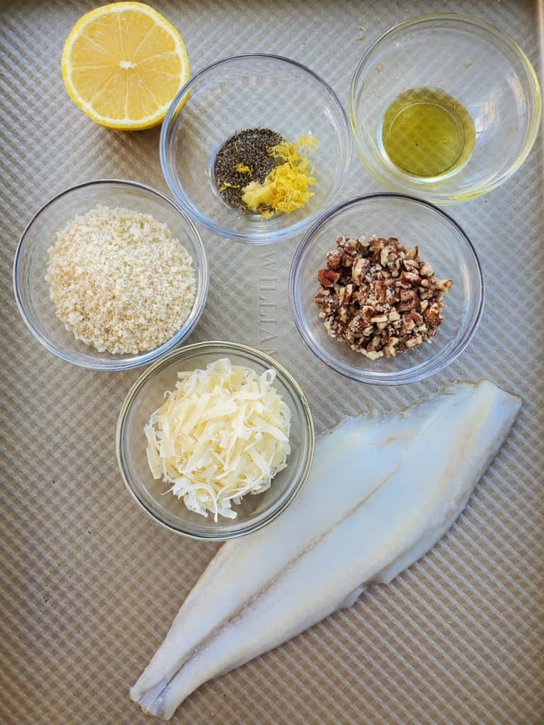All the ingredients for Parmesan Crusted Flounder - garlic, lemon juice, olive oil, parmesan cheese, flounder