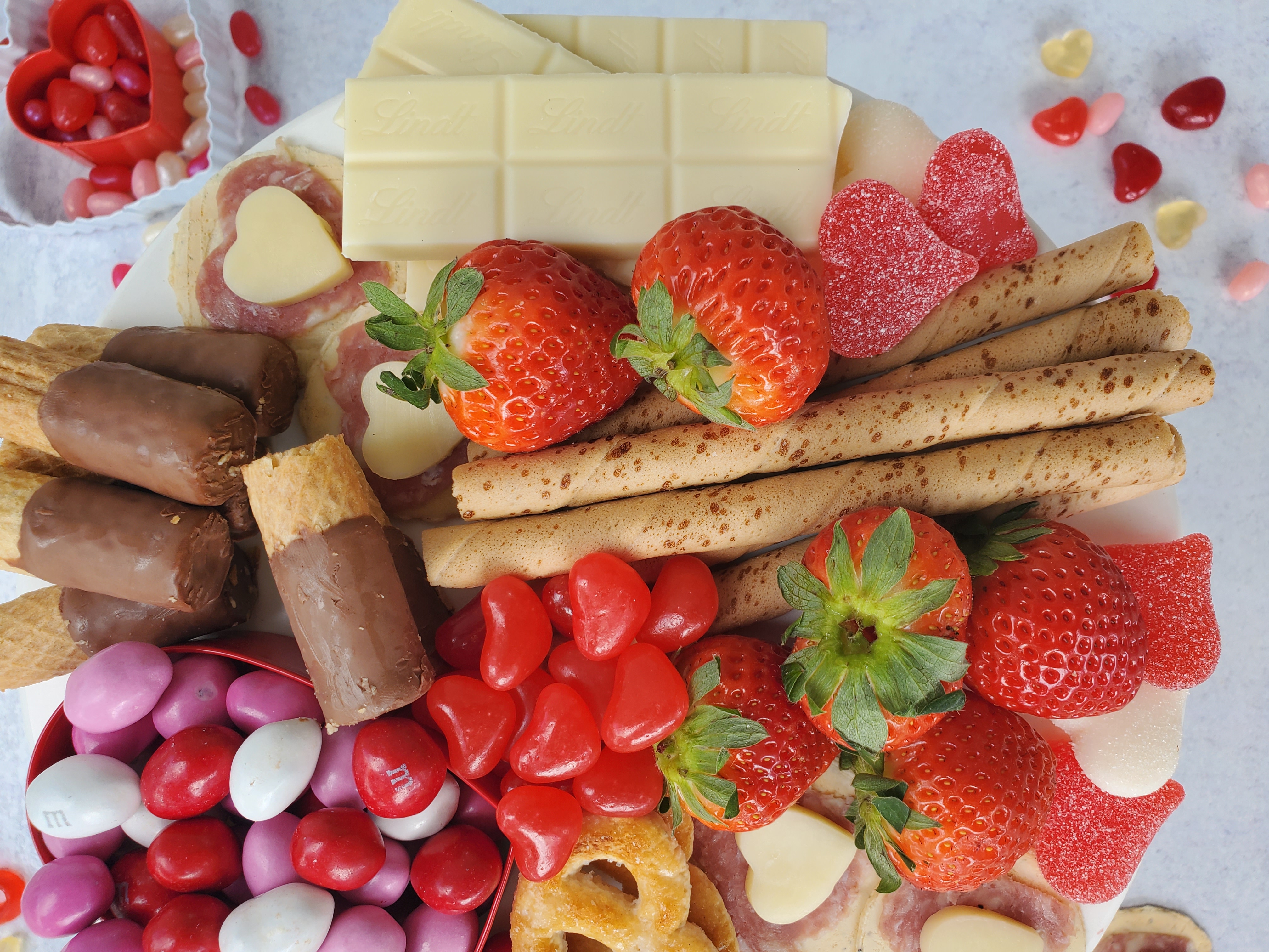 close-up of a dessert board with candy and cookies