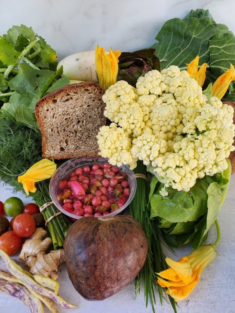 farmer's market haul: chickpea salad, squash blossoms, ginger, tomatoes, custard apple, fioretto, lettuce, radish, dill