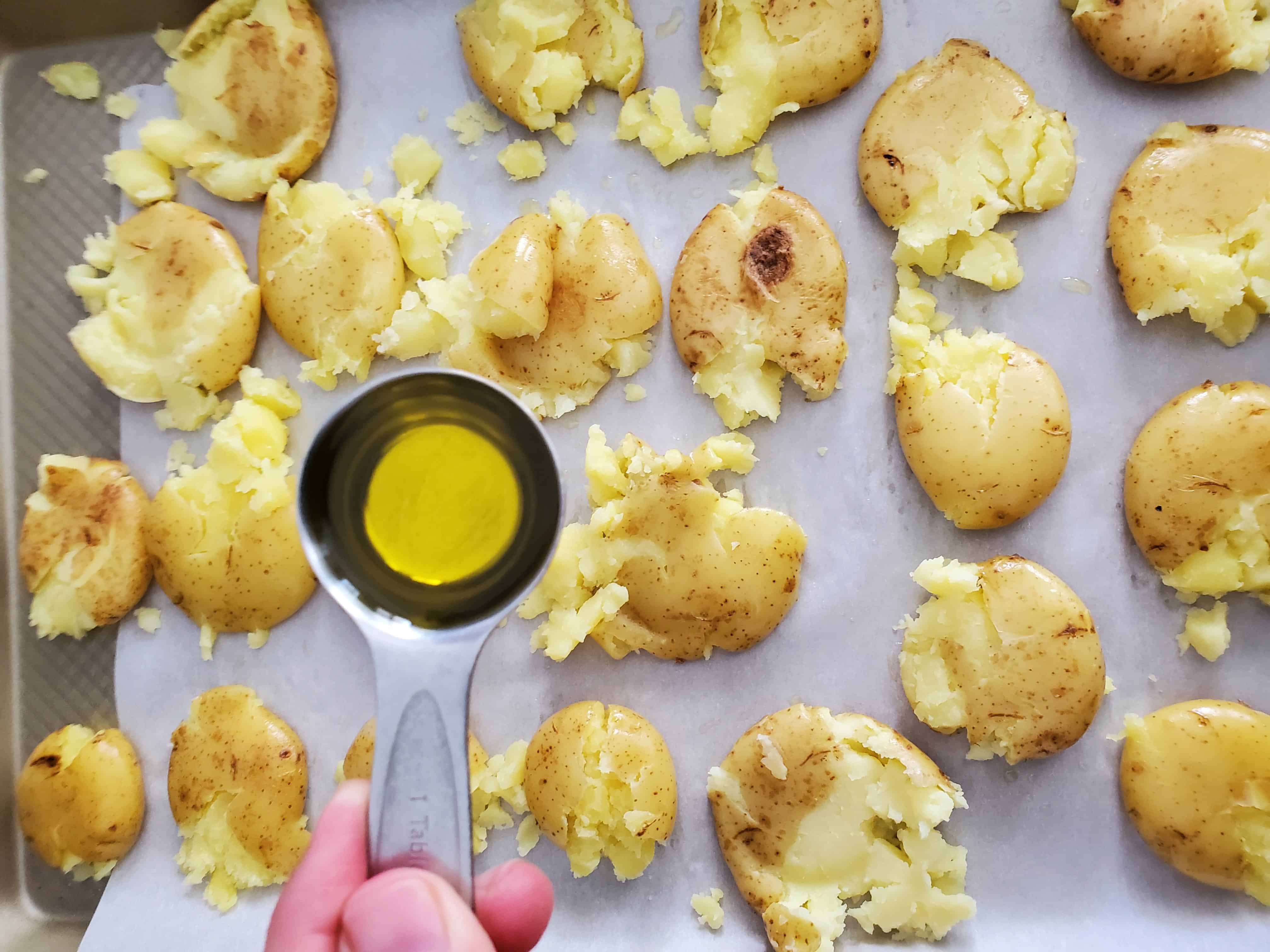 adding more oil to the potatoes as they're baking