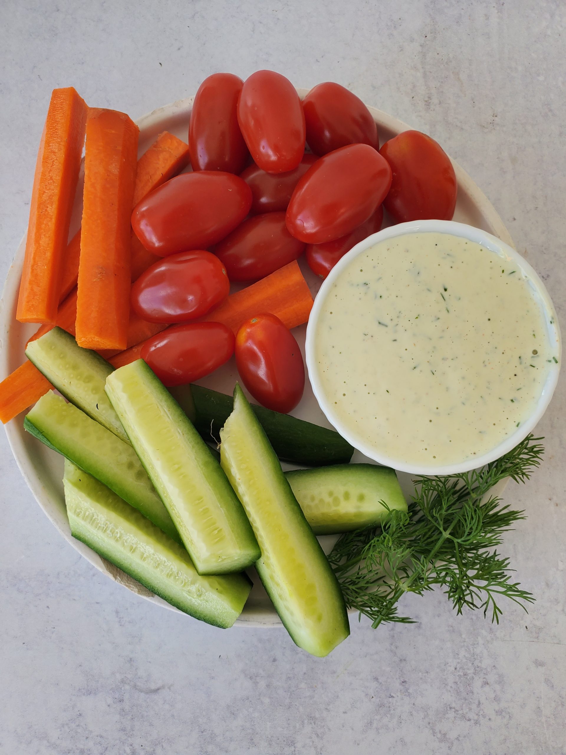 Buttermilk Ranch Dressing in a dish with raw vegetables