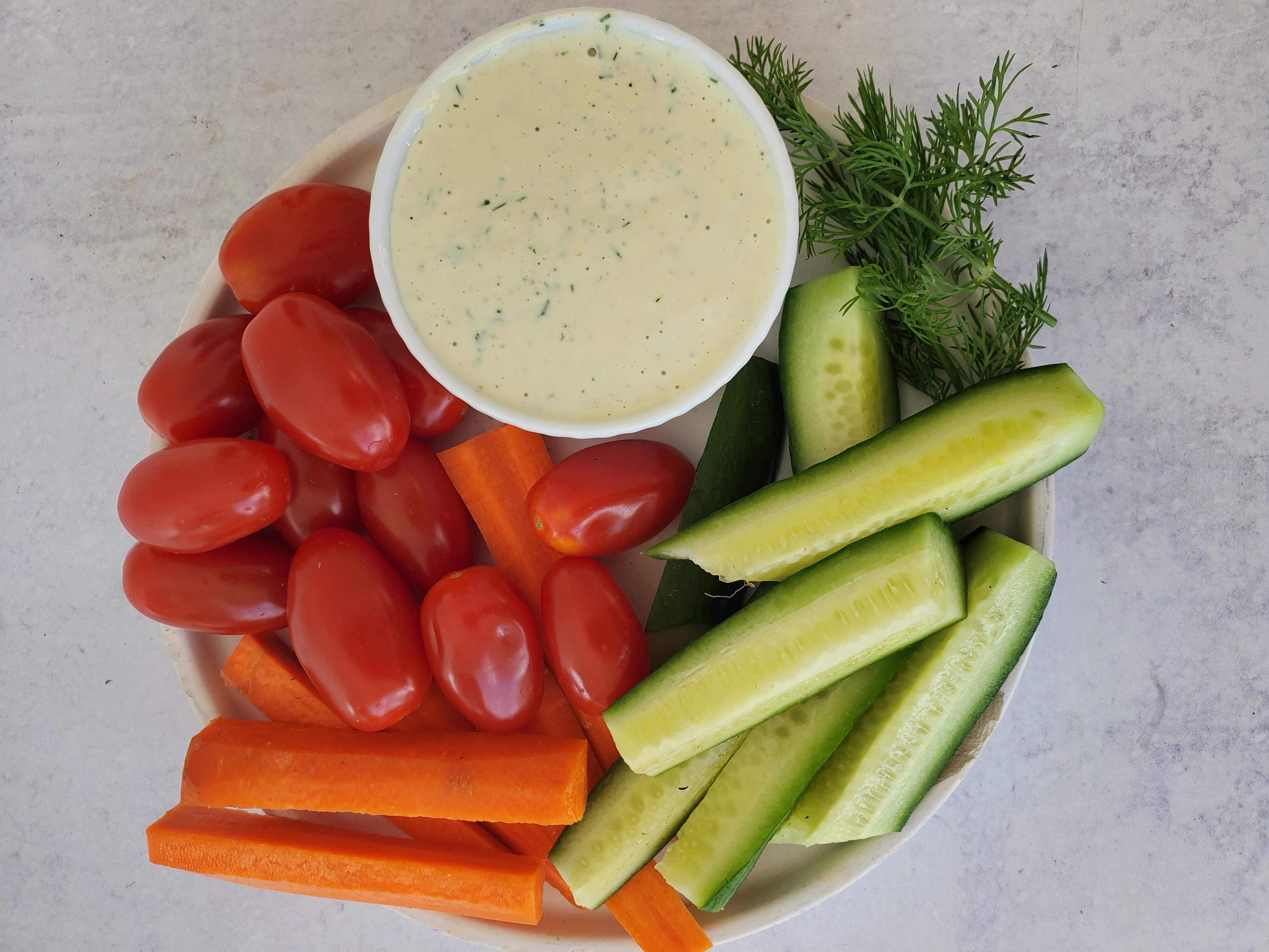 Buttermilk Ranch Dressing in a dish with raw vegetables