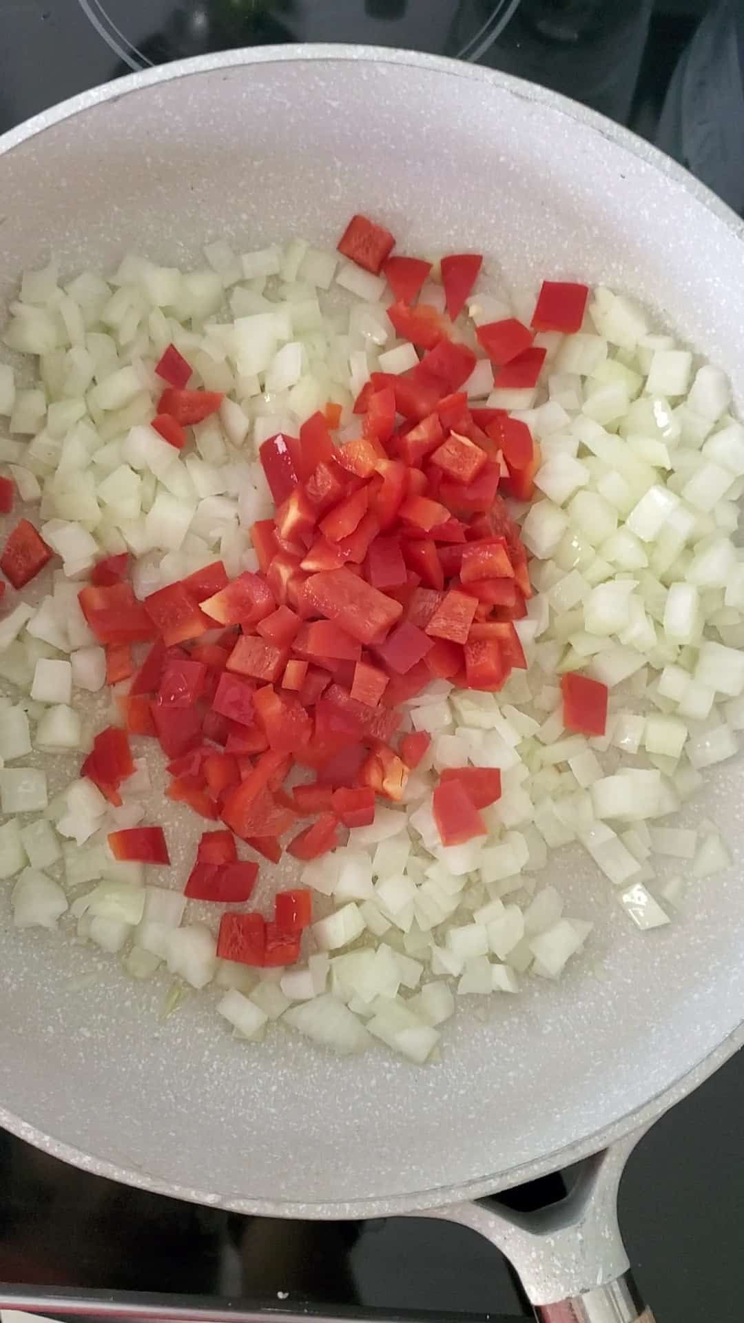 diced onions and red pepper sauteeing