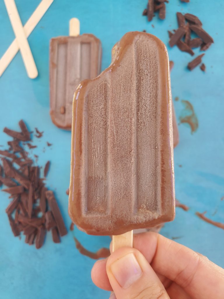 homemade fudge popsicle up close holding it in my hand
