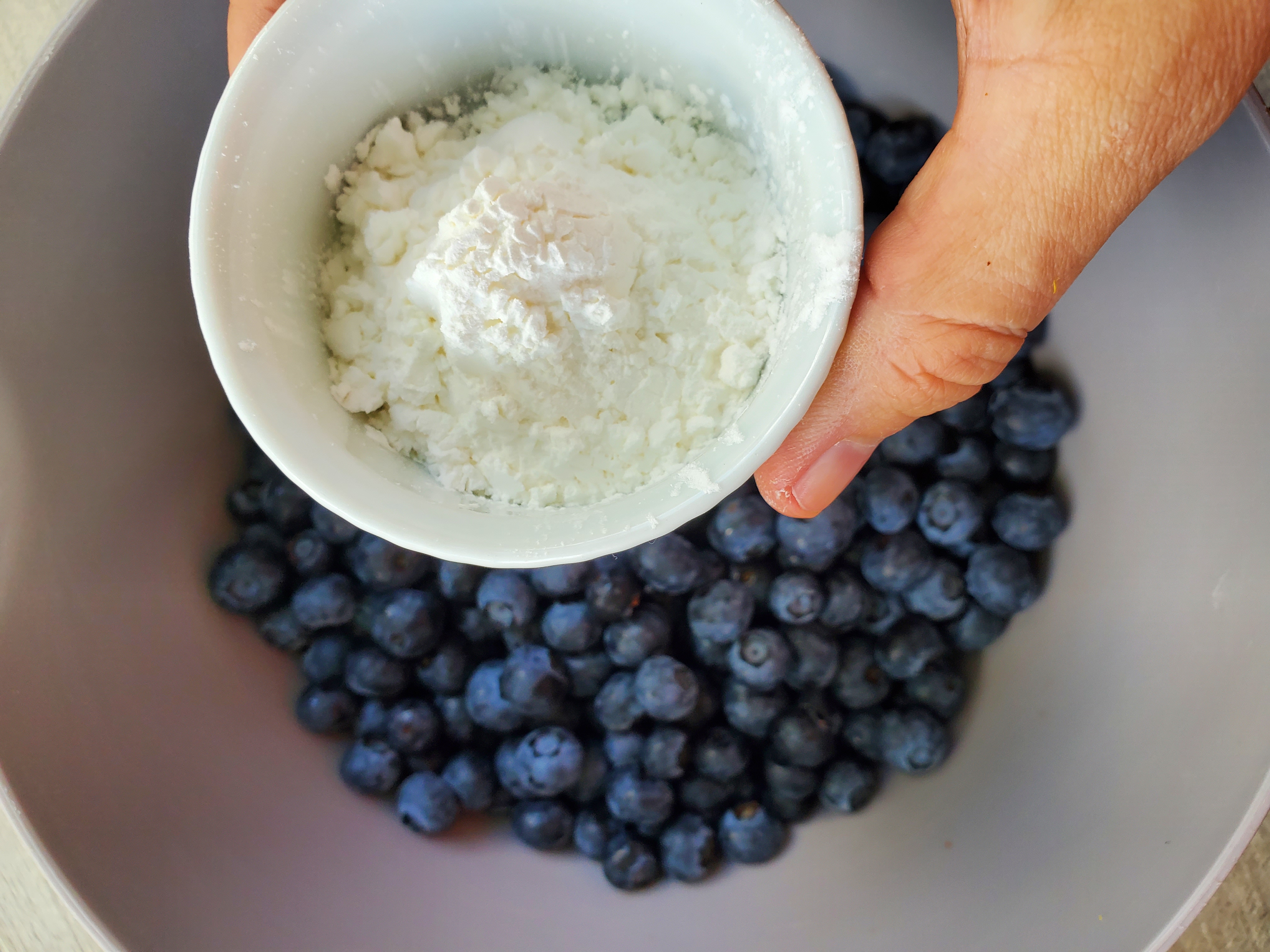 bowl of blueberries about to have cornstarch added