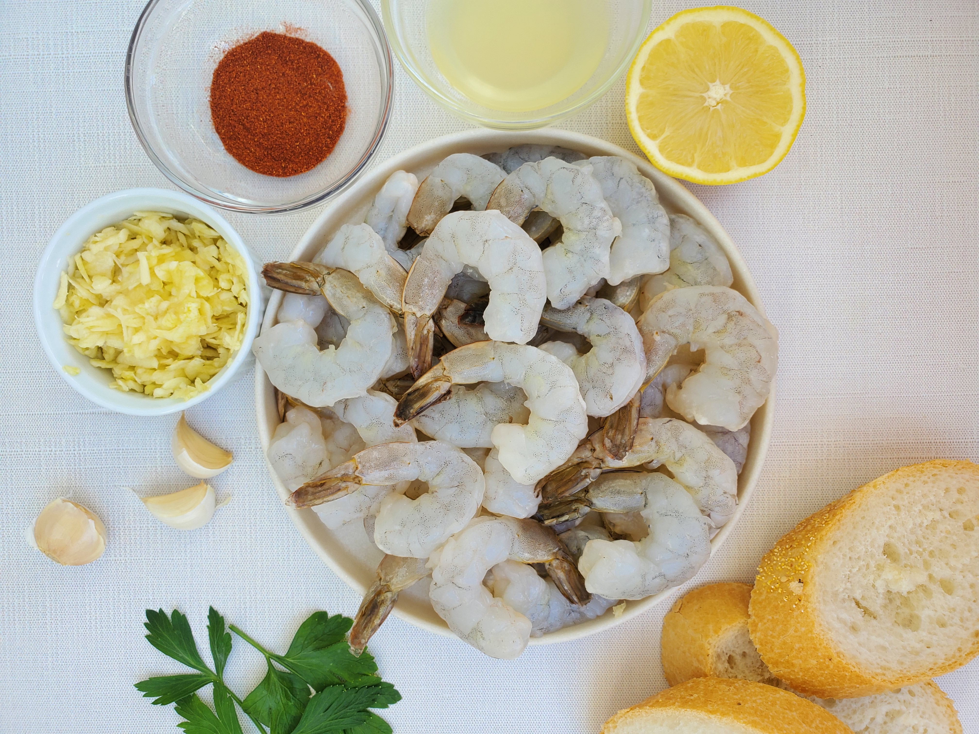 raw shrimp, olive oil, garlic, parsley, lemon, baguette
