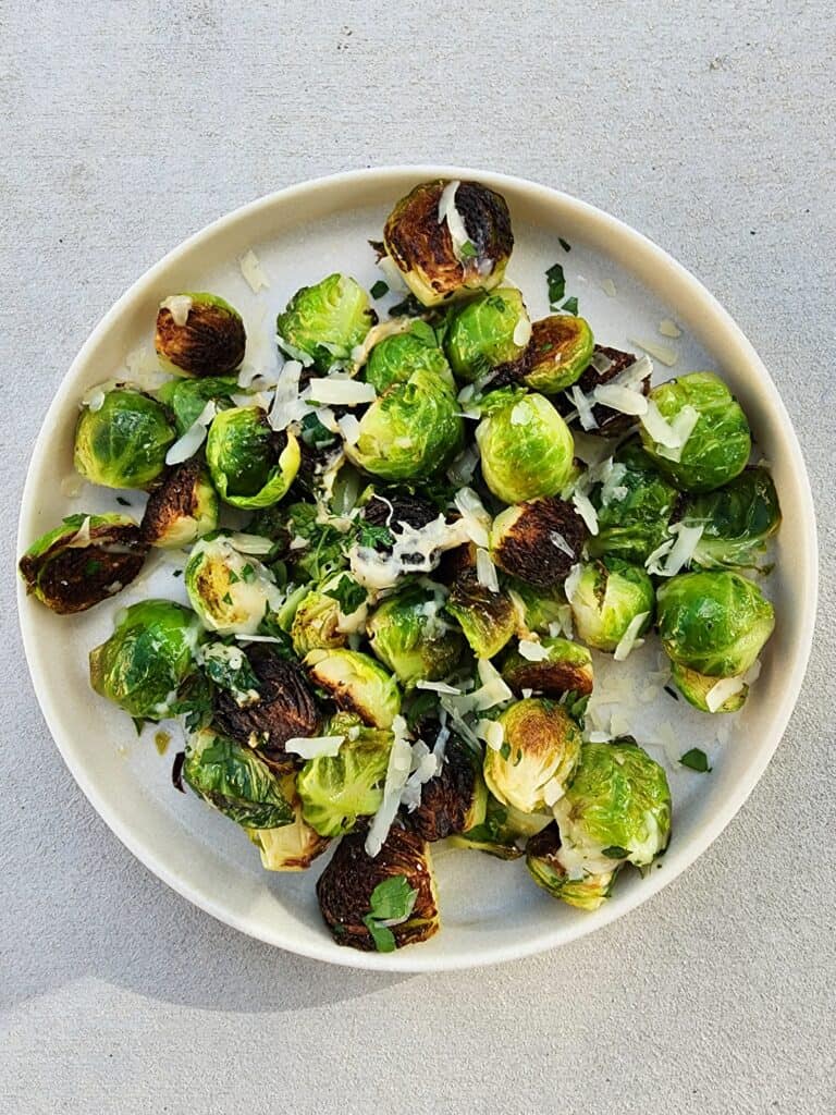 plate of skillet roasted brussels sprouts with parmesan cheese