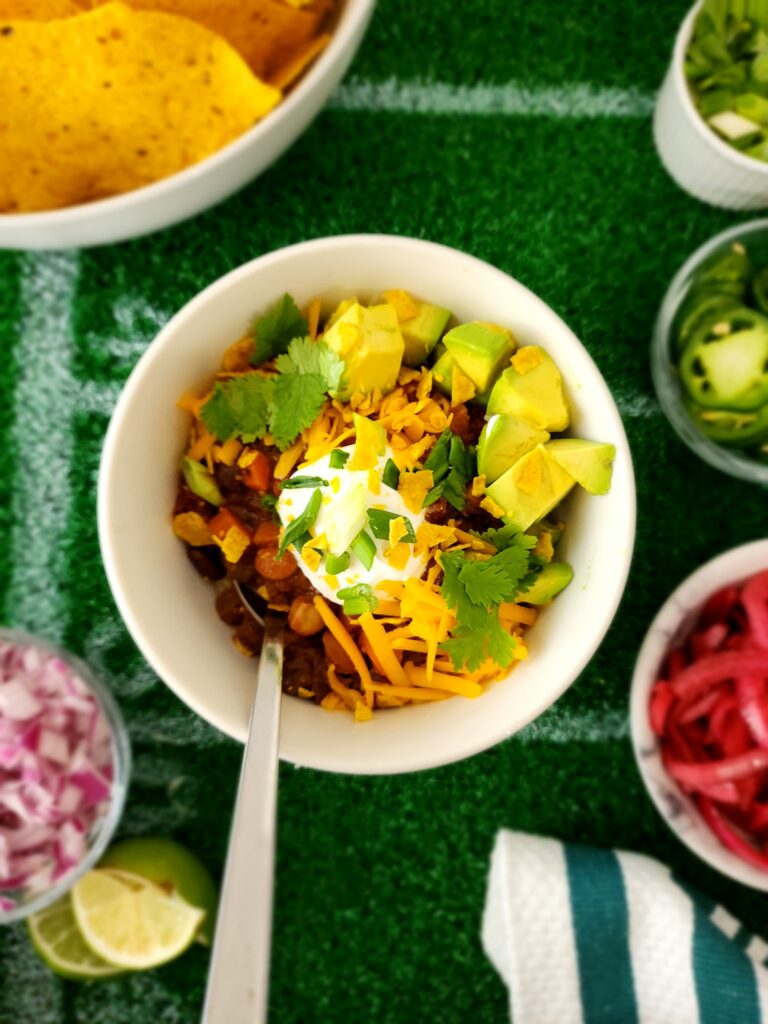 How To Set Up A Chili Bar - Chili Bowl with Shredded Cheese, Sour Cream, Avocado, and Scallions