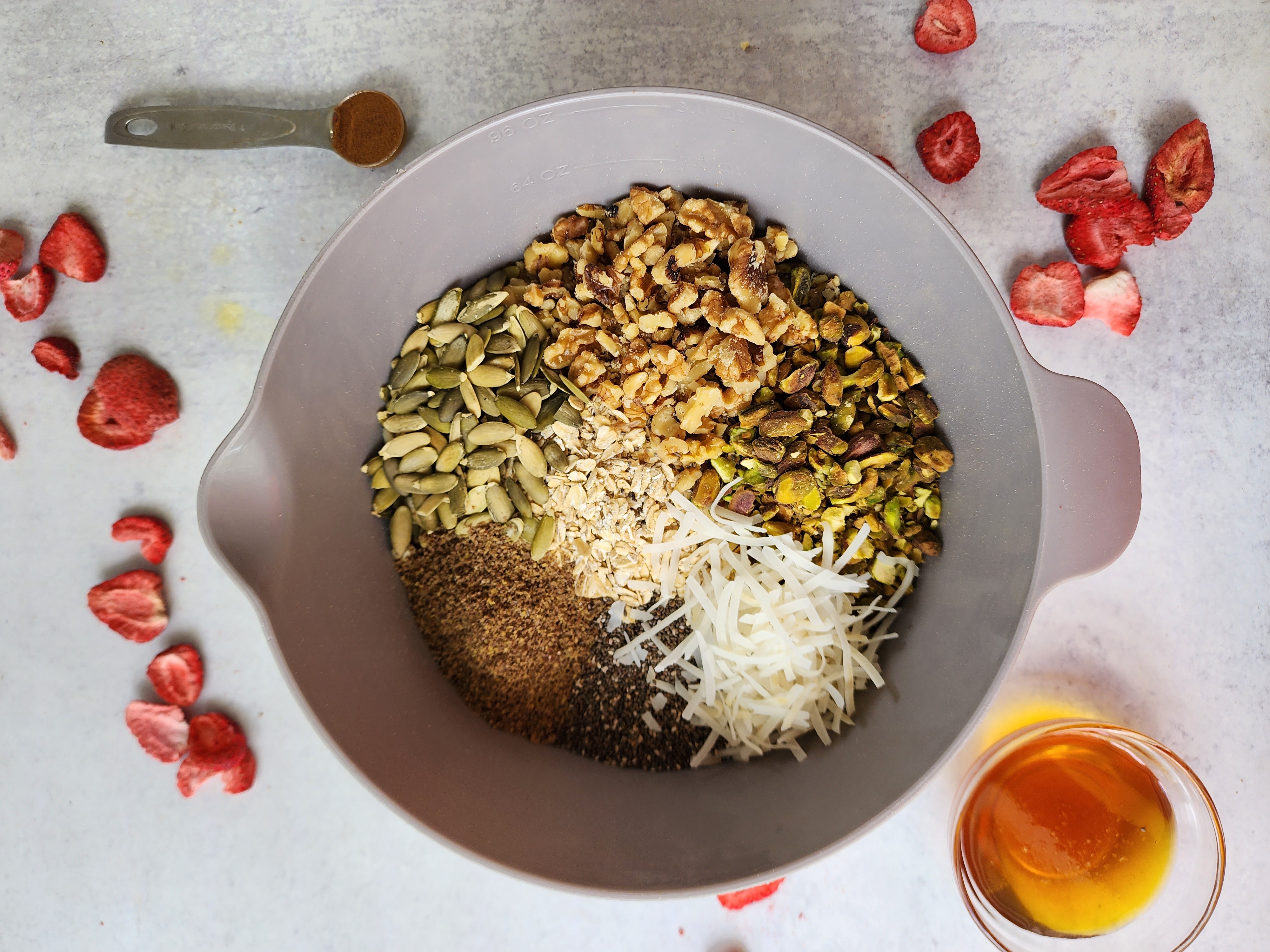 Bowl of all the ingredients for homemade muesli ready to be stirred