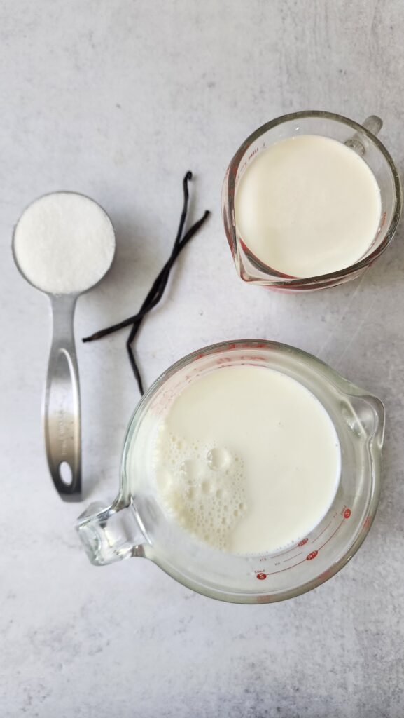 ingredients for homemade vanilla ice cream: heavy cream, whole milk, vanilla bean, sea salt