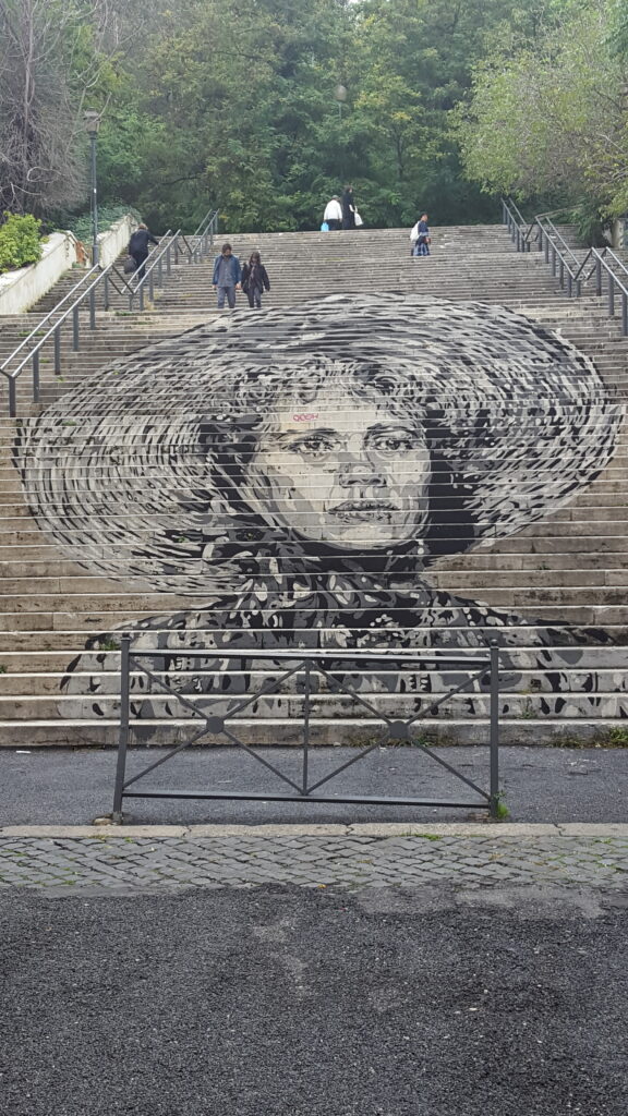 Art on the side of the stairs to form a picture