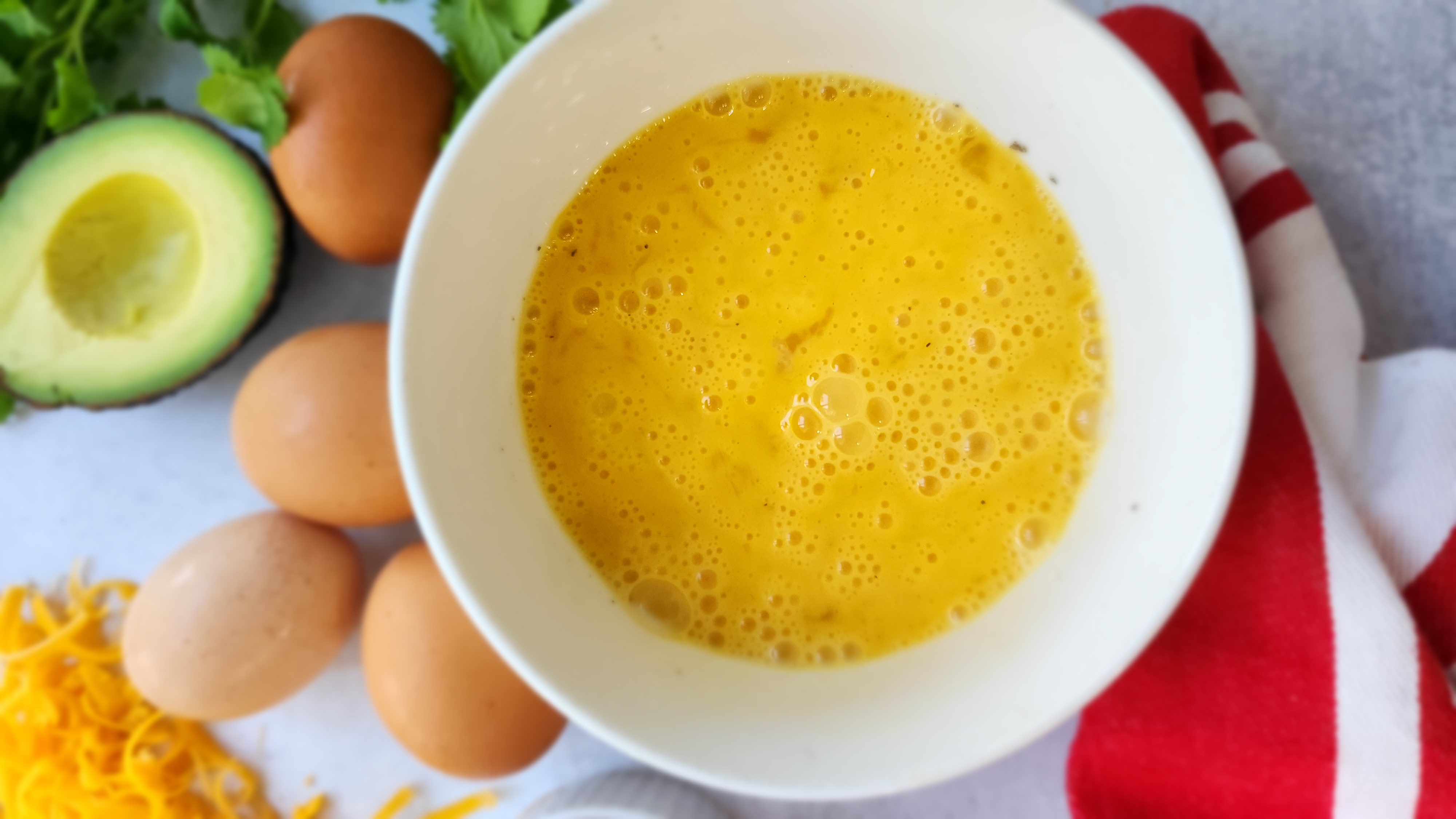 Whisked eggs in a bowl for breakfast tacos