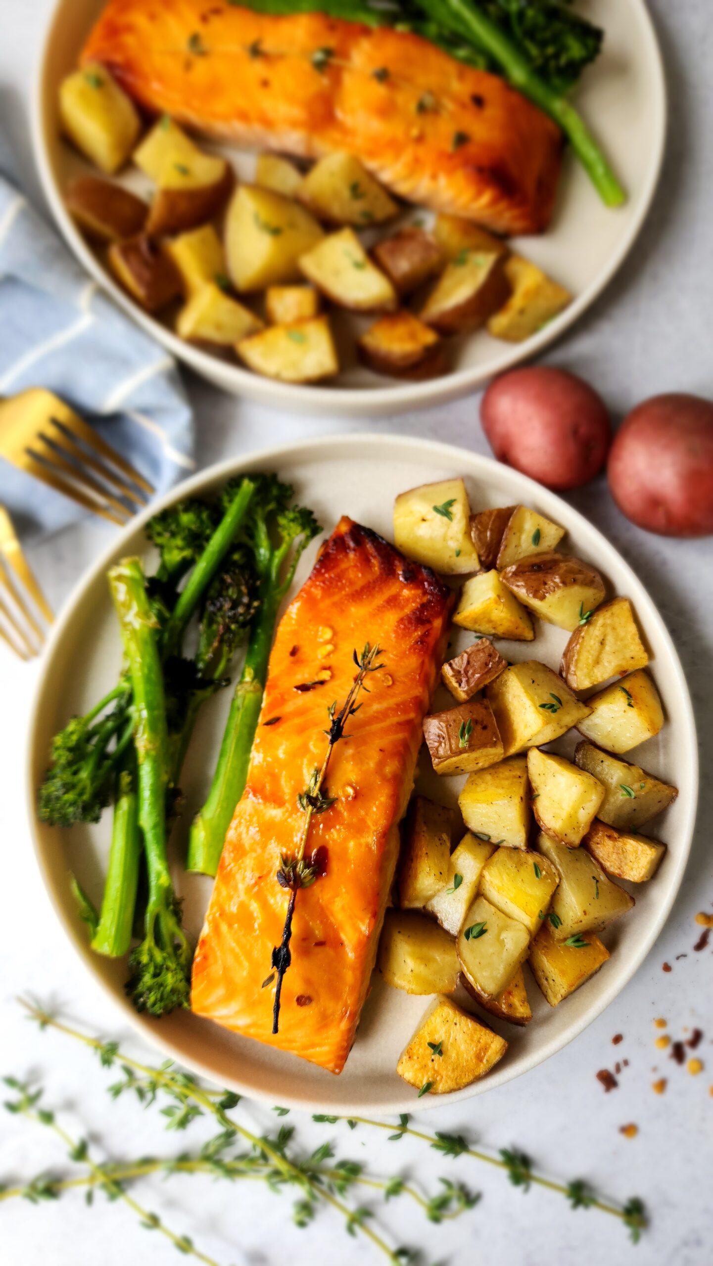 Plated Honey-Dijon Roasted Salmon with roasted potatoes and broccolini