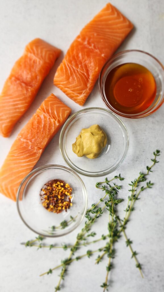 All the ingredients for Honey-Dijon Roasted Salmon:  salmon, honey, dijon mustard, thyme
