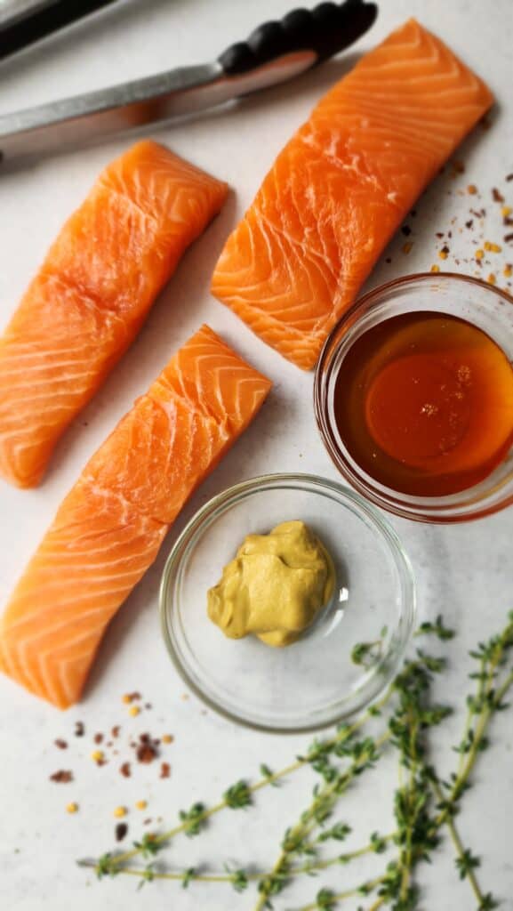 Ingredients for Honey-Dijon Roasted Salmon:  salmon, dijon mustard, honey, and thyme