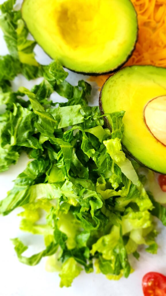 toppings for taco salad - close-up of the lettuce.