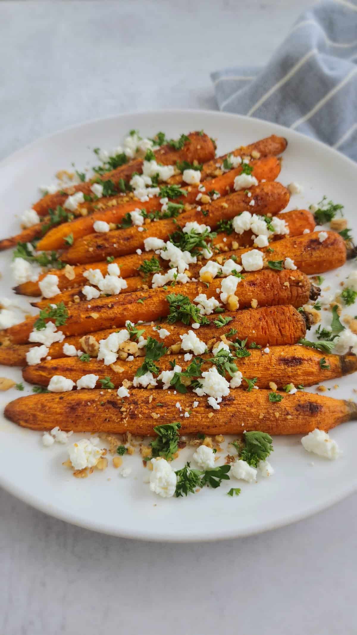 Roasted Carrots with Garlic Walnuts and Goat Cheese on a plate