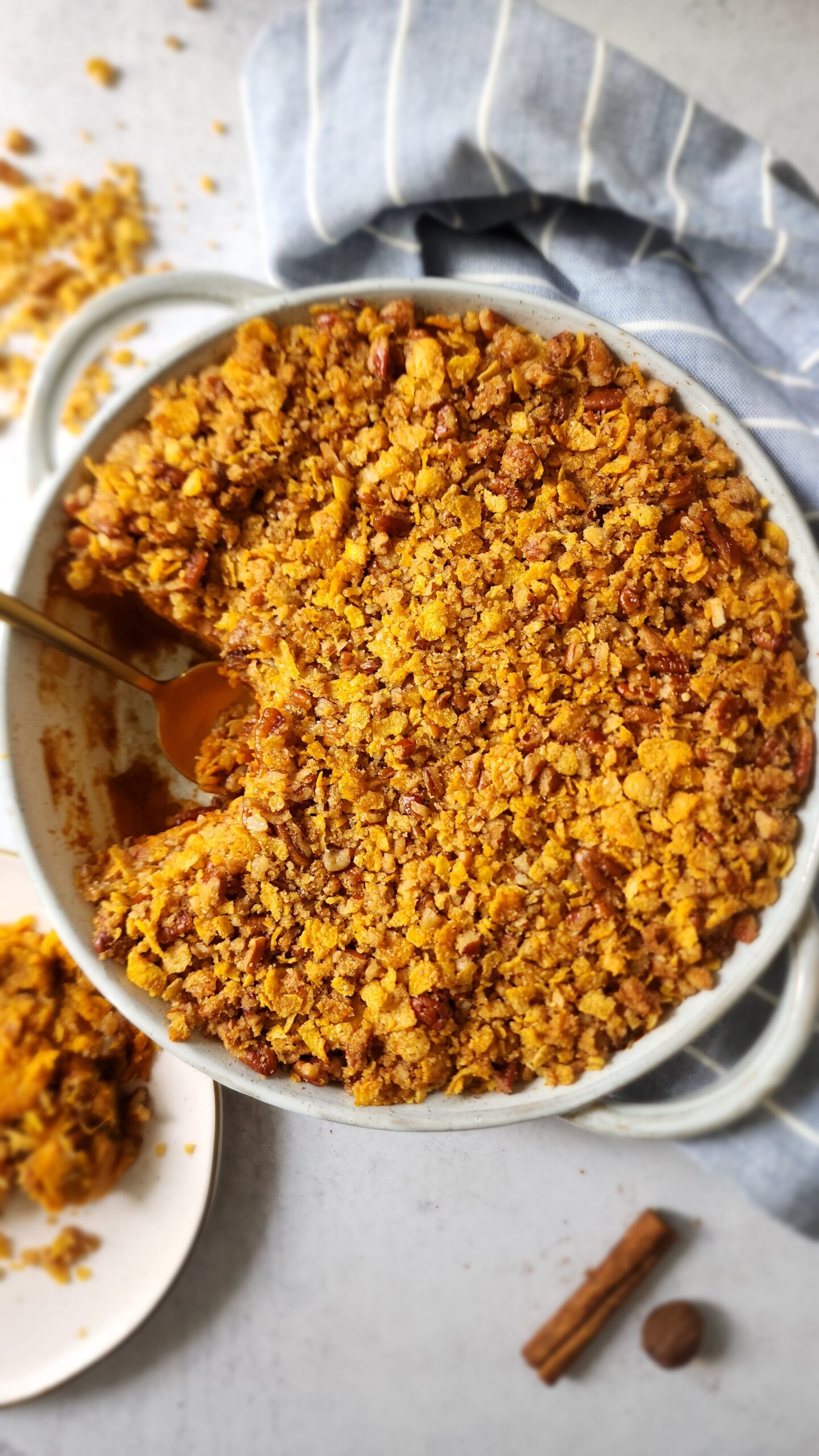 Sweet Potato Casserole in a casserole dish with a scoop out