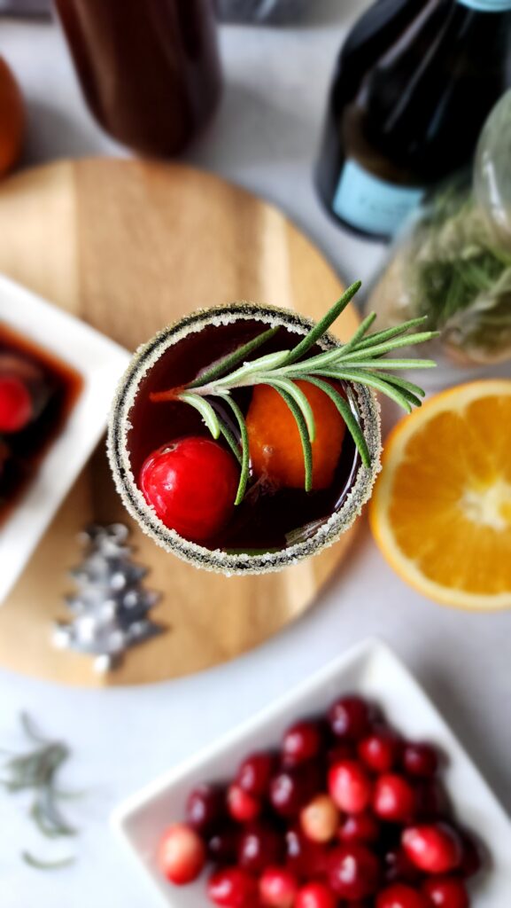 top shot of a sugared rimmed pomegranate mimosa