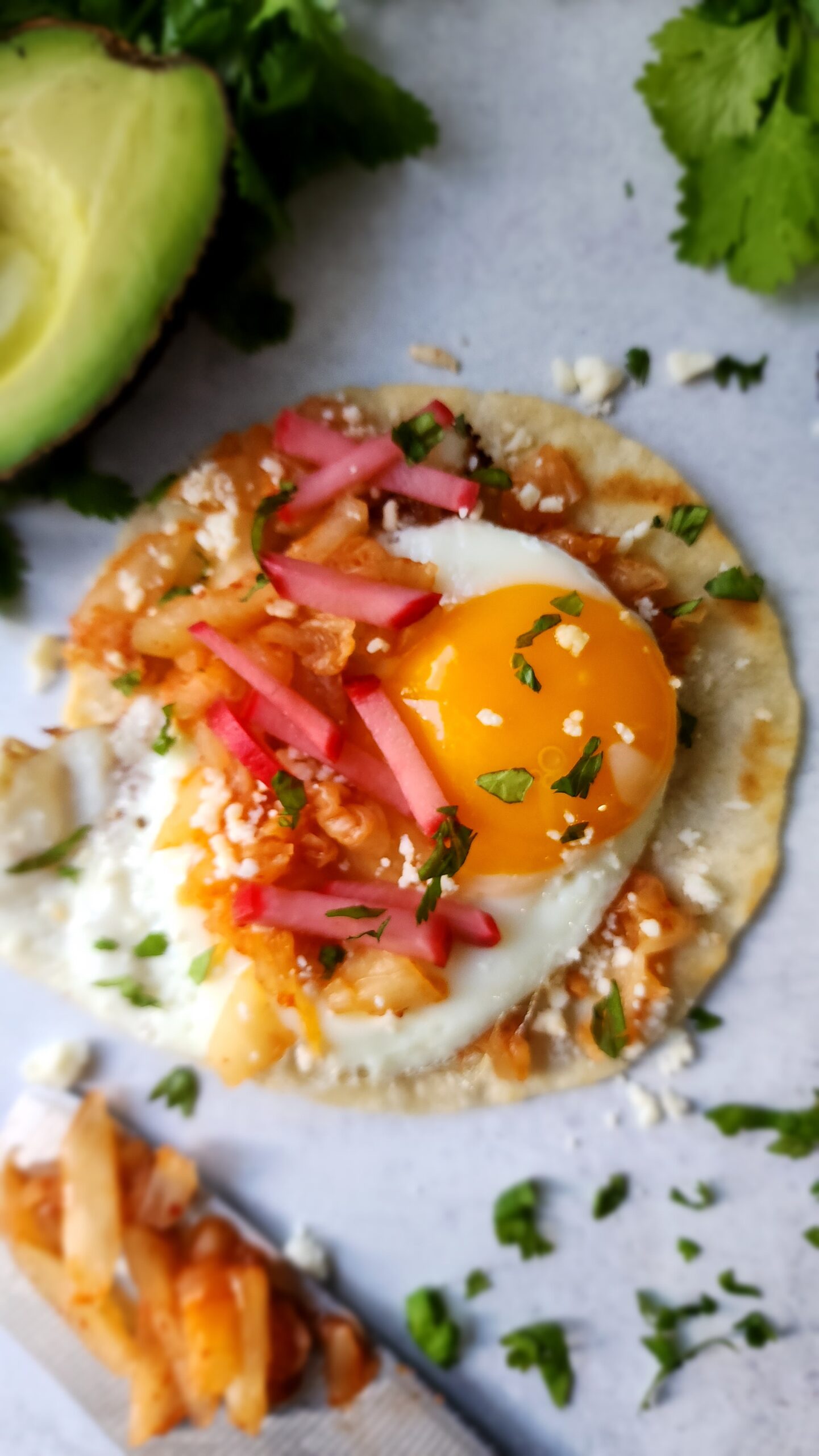'Fried' Egg with Kimchi on a flour tortilla for an egg taco