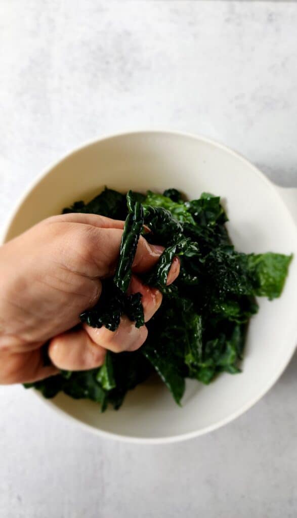 massaging oil into kale for air fryer kale chips